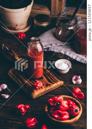 Preparing of Hot Chili Sauce with Habanero Peppers, Charred Bell Peppers and Tomatoes 121503657