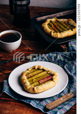 Rhubarb mini galette on white plate 121503709