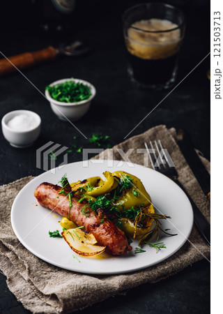 Baked pork sausage with green bell peppers, onion and herbs Baked pork sausage with green bell peppers, onion and herbs 121503713