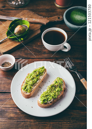 Avocado toasts and coffee for breakfast 121503780