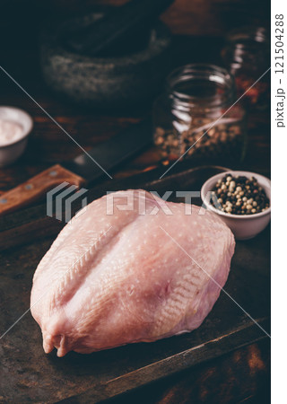 Raw chicken breast with spices Raw chicken breast with spices 121504288