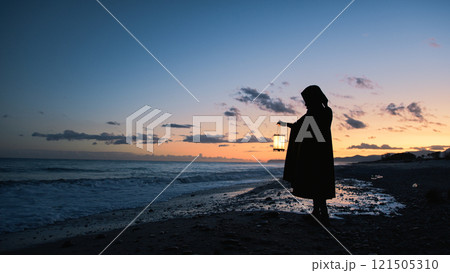 Solitary Figure Hunts for Answers At Sunset Shore  121505310