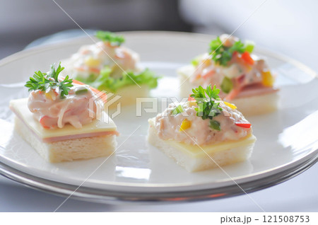 canape or toast with ham , cheese , crab stick and tuna 121508753