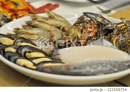 raw crab , raw shrimp , raw fish and raw shell raw crab , raw shrimp , raw fish and raw shell 121508754