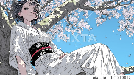 満開の桜の木下を歩く若い女性