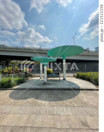 Hong Kong cityscape, retro cultural pavilion in park near road, bridge 121511158