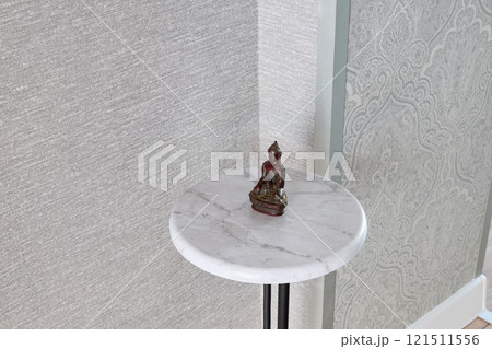 This stunning and elegant corner table features a beautifully crafted Buddha statue decor piece This stunning and elegant corner table features a beautifully crafted Buddha statue decor piece 121511556
