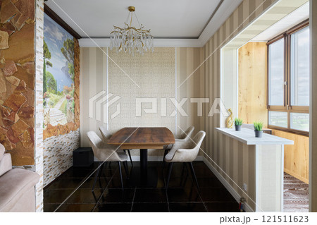 An Elegant Dining Space Featuring Modern Design, Abundant Natural Light, and Comfort 121511623