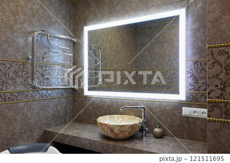 Explore the Contemporary Modern Bathroom Design Featuring a Stylish Stone Sink and an LED Mirror 121511695
