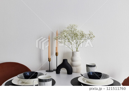 Elegant Table Setting with Minimalist Decor and Fresh Flowers for a Perfect Dining Experience Elegant Table Setting with Minimalist Decor and Fresh Flowers for a Perfect Dining Experience 121511760