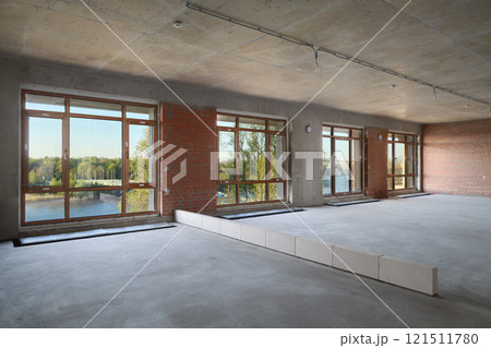 A modern minimalist interior that features stunning panoramic windows for breathtaking views 121511780