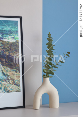 Explore Modern Minimalist Decor Featuring Eucalyptus in a Beautifully Stylish Vase 121511792