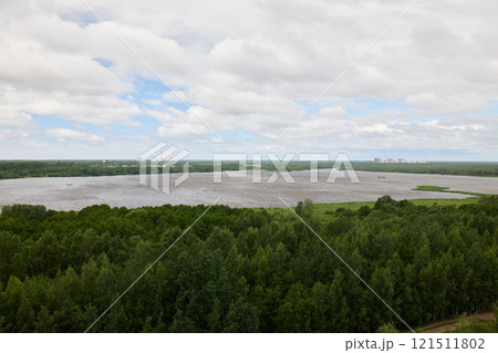Aerial View of a Beautiful and Serene River Landscape Surrounded by Lush Greenery and Nature 121511802