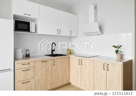 Contemporary Modern Kitchen Design Featuring Chic White Cabinets and a Minimalist Style 121511813