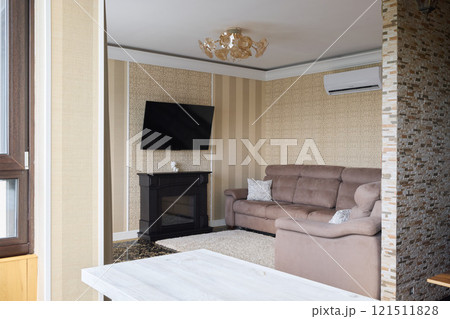A Modern and Cozy Living Room Filled with a Stylish TV and Gorgeous Elegant Decor Elements A Modern and Cozy Living Room Filled with a Stylish TV and Gorgeous Elegant Decor Elements 121511828