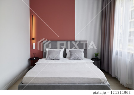 A Modern Bedroom Interior Featuring a Cozy and Inviting Design for Ultimate Comfort and Relaxation 121511962