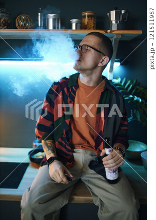 Guy Smoking And Drinking At Party Guy Smoking And Drinking At Party 121511987