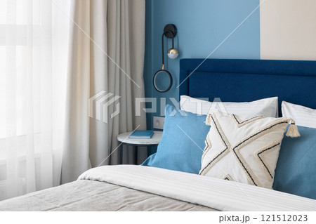 A Modern Cozy Bedroom Featuring Stylish Decor That Incorporates Soothing Colors and Elements A Modern Cozy Bedroom Featuring Stylish Decor That Incorporates Soothing Colors and Elements 121512023