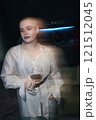 Woman Drinking Wine At Party 121512045