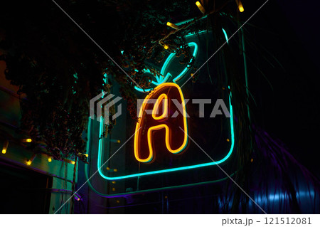 A Beautiful and Vibrant Neon Sign Featuring the Letter A Illuminated at Night in the City A Beautiful and Vibrant Neon Sign Featuring the Letter A Illuminated at Night in the City 121512081