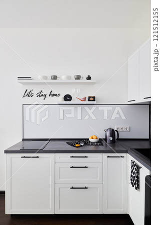 Explore Modern Kitchen Design Featuring Sleek White Cabinets and Stylish Elegant Decor 121512155