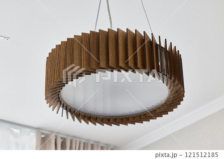 A unique and modern pendant light fixture that features a beautifully textured design, 121512185