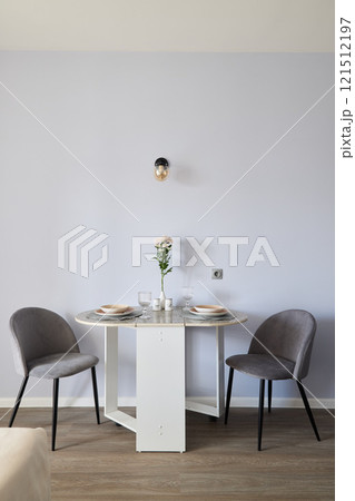 A Modern Dining Space Showcasing Elegant Decor and Contemporary Aesthetic Elements 121512197