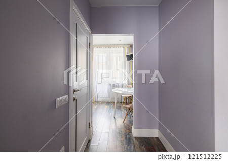 This hallway has light purple walls beautifully complemented by stylish flooring choices This hallway has light purple walls beautifully complemented by stylish flooring choices 121512225