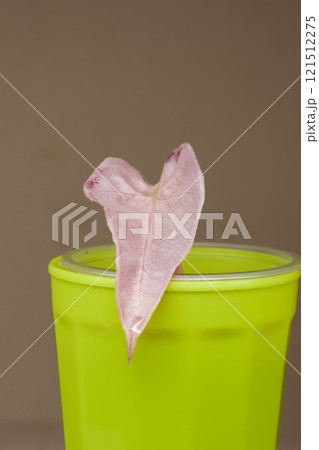 This is a Colorful Cup that features a Unique Leaf Decoration, showcasing its artistic beauty This is a Colorful Cup that features a Unique Leaf Decoration, showcasing its artistic beauty 121512275