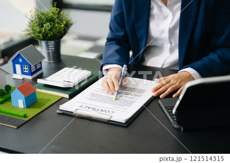 Considering buying a home, investing in real estate. Broker signs a sales agreement. agent, lease agreement, successful Considering buying a home, investing in real estate. Broker signs a sales agreement. agent, lease agreement, successful 121514315