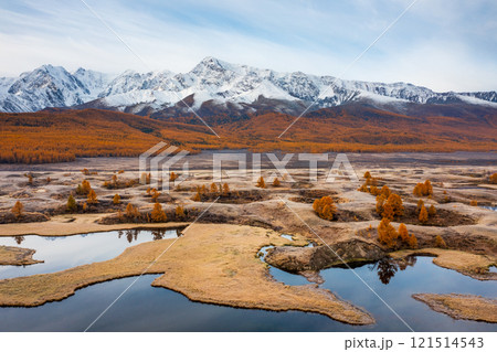 Beautiful autumn landscape with mountains, trees, and water reflections in Altai Beautiful autumn landscape with mountains, trees, and water reflections in Altai 121514543