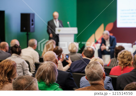 Audience listening to speakers during a professional business conference session 121514550