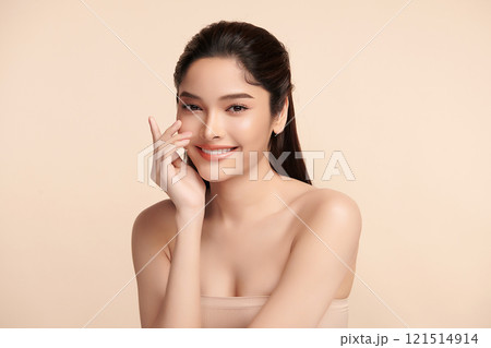 Beautiful Young transgender woman with clean fresh skin on beige background, Face care, Facial treatment, Cosmetology, beauty and spa, transgender women portrait. 121514914