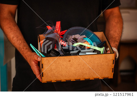 Cardboard carton boxes stack with household belongings in modern house living room. Packed containers on floor in new home. 121517961