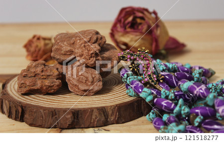 Southwestern Style Jewelry on Wooden Table With Rustic Decor 121518277