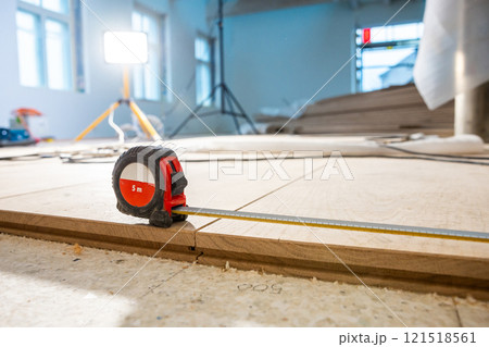 Indoor Construction Scene with Measuring Tape and Work Light 121518561
