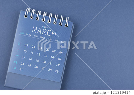 March 2025 calendar on blue color background. Desk calendar for planning. March 2025 calendar on blue color background. Desk calendar for planning. 121519414