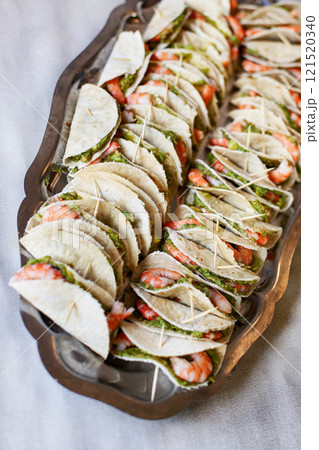 Platter of small pancakes for a cocktail 121520340