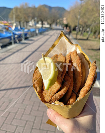 Anchovies fried in oil. Traditional local fish dish. Bunch of food at sea. Fast food. Italy, Liguria and national meals. Anchovies fried in oil. Traditional local fish dish. Bunch of food at sea. Fast food. Italy, Liguria and national meals. 121520405