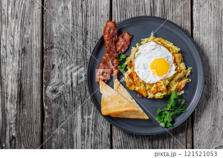 Bubble and Squeak with bacon, toasts, fried egg Bubble and Squeak with bacon, toasts, fried egg 121521053