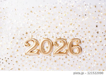 Holiday background Happy New Year 2026. Numbers of year 2026 made by gold candles on bokeh festive sparkling background. celebrating New Year holiday, close-up. Space for text 121522090