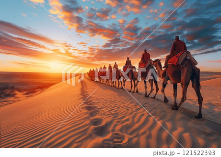 A caravan of camels traverses golden sand dunes at sunset, creating a mesmerizing view of nature's beauty. A caravan of camels traverses golden sand dunes at sunset, creating a mesmerizing view of nature's beauty. 121522393