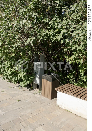 two trash cans, container for dog excrement in the park, close-up. place for walking dog in park. 121522878
