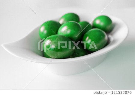 Traditional green easter eggs. Chicken eggs are painted red Traditional green easter eggs. Chicken eggs are painted red 121523076