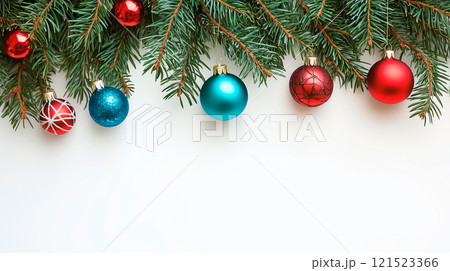 Fir twigs with colored Christmas decoration on white 121523366