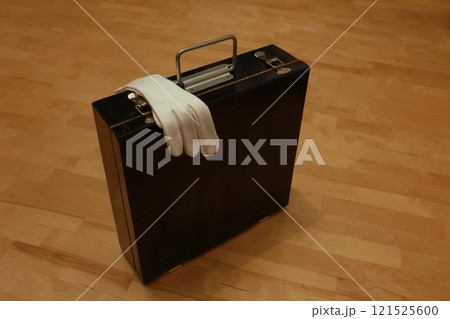 Black suitcase still life Black suitcase, white gloves still life 121525600
