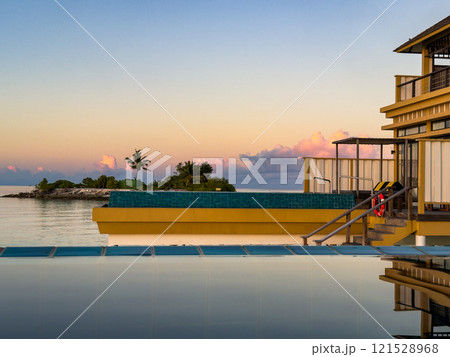Sunset views from overwater pool villa in Maldives Sunset views from overwater pool villa in Maldives 121528968