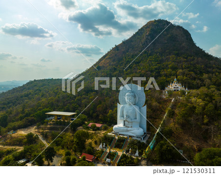 Aerial of white big Buddha front of the big mountain 121530311