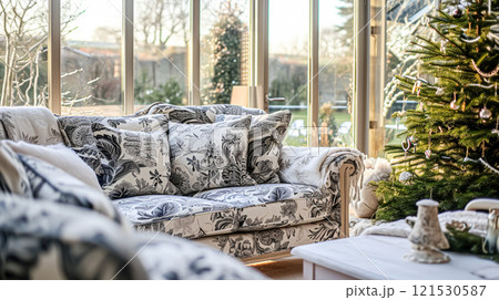 Colorful pillows on sofa against glass wall of window in a winter garden or conservatory. Interior textile concept. High quality photo 121530587
