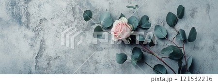 A stylish arrangement of roses and eucalyptus leaves rests elegantly against a textured concrete background, creating a modern aesthetic. Generative AI 121532216